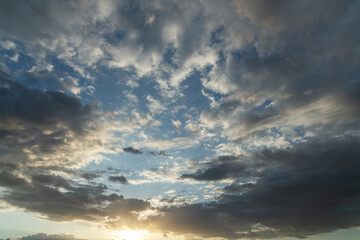 Wall Mural - Beautiful bright sunset sky background with clouds.  Evening time.