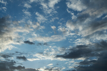 Wall Mural - Beautiful sunset  with evening clouds on dramatic sky.