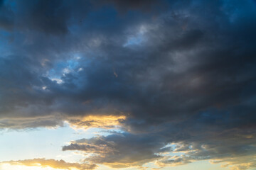 Wall Mural - Beautiful bright sunset sky background with clouds.  Evening time.