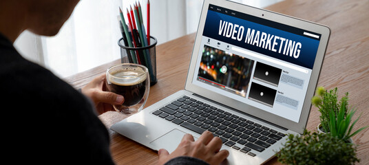 Wall Mural - video marketing concept on laptop screen. video marketing advertising business on social media and i