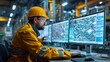 © Ramlan - Engineer in hardhat works on computers in a large industrial factory setting