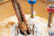 © andrei310 - Corrosion and mineral deposits on the heating element of an electric boiler. Boiler maintenance and repair