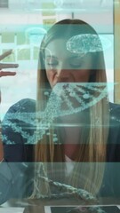 Wall Mural - Screens with medical data processing against caucasian woman talking looking at the camera
