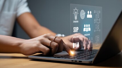 Hands typing on laptop with digital interface image