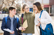 © JackF - Teenage students spending time together after lessons, talking and having fun outdoors