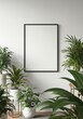 © UrFreepik360 - Photo of blank frame hangs on a white wall surrounded by plants