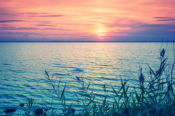 Wall Mural - Seascape in the early morning. Beautiful sunrise over the sea