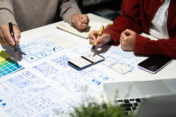 creative digital development agency. developer team brainstorming on their project with laptop, smar