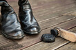 © Austockphoto - One polished and one unpolished boot