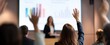 © IKM - The audience raises hands during an engaging presentation about business statistics and growth.
