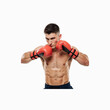 © ELKAHLAOUI - Boxer in Action: A determined boxer, clad in red gloves, intensely focuses during a moment of training, showcasing his athleticism, strength, and unwavering commitment to the sport.
