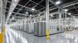© Khan - A large, empty warehouse with rows of servers and data centers.