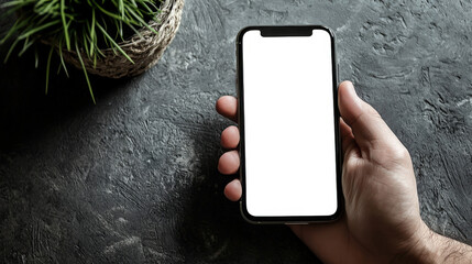Close-up of a phone with an empty screen in the hand of a white guy, top view. Phone mockup. Presentation of the mobile application