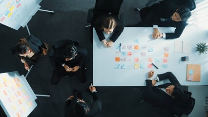 Wall Mural - top down aerial view of professional business team present project and turn around to clap hands and