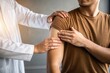 © JARA - Doctor examining a patient s shoulder with a gentle touch and supportive gesture