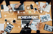 © InfiniteFlow - A top-down view of a collaborative meeting focused on achievement and success, showcasing teamwork, strategy, and business analysis in a professional workspace. Amity