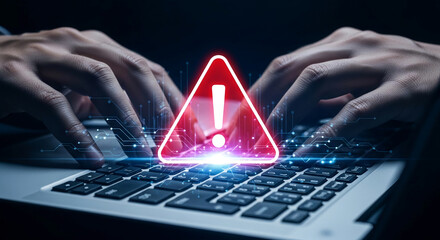 Wall Mural - hands typing on laptop keyboard with warning sign, symbolizing online security threat or system aler