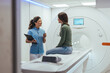 © Dragana Gordic - Healthcare Worker Discussing MRI Procedure with Patient in Medical Imaging Room