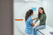 © Dragana Gordic - Healthcare Professional Assisting Patient During MRI Scan Checkup Session