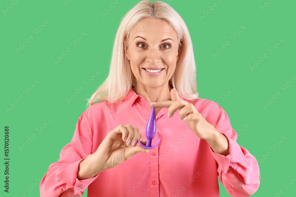 Mature woman with anal plug on green background Stock Photo | Adobe Stock Mature woman with anal plug on green background Stock Photo | Adobe Stock