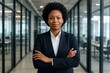 © Jelena - Successful African American business leader displaying confidence in contemporary corporate office