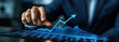 © Nathasa - Photography advertising shot of close up businessman touching an upward arrow on a virtual graph with empty background.