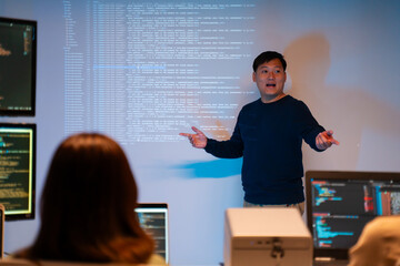 asian software engineer or programmer team working late in development office,problem solving or alg