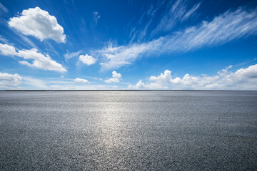 Wall Mural - empty asphalt road square and beautiful blue sky with white clouds on a sunny day