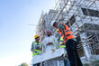 © Jack Tamrong - Arab investor man discussing with builder team in  construction site