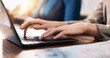 © peopleimages.com - Laptop, hands and businesswoman in office with research for email or contact for investment proposal. Technology, typing and female financial manager with computer for online finance report.