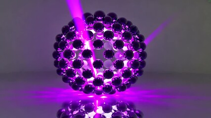 Wall Mural - a vibrant purple sphere composed of reflective spheres, illuminated by beams of light, showcasing a 