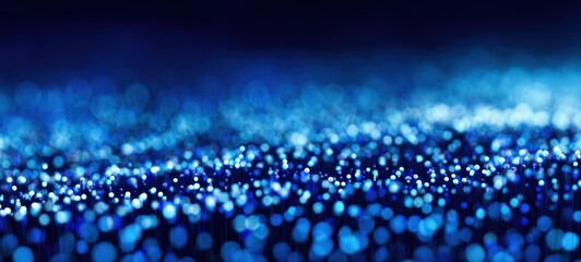 The shimmering blue background filled with ethereal bokeh lights.