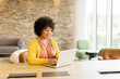 © Westend61 - Entrepreneur working on a laptop in a modern office setting
