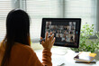 © Prathankarnpap - Young asian woman speaking during a video conference at home