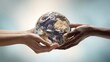 © Bog - The hands holding the Earth symbolizing unity and global cooperation.