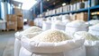 © photostockatinat - Bags of rice are stored in a warehouse. The scene captures the abundance and organization of a food storage facility