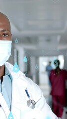 Wall Mural - animation of network of medical icons and data processing over african american male doctor