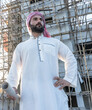 © Jack Tamrong - Arabic architect man holding floorplan blueprint in construction site