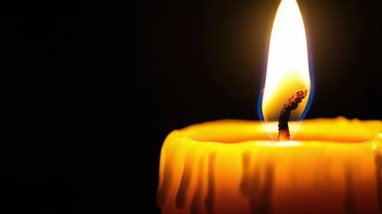 Wall Mural - a lone candle providing light in darkness