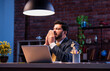 © StockImageFactory - Indian businessman sneezing coughing at desk, shows signs of seasonal illness during office work