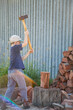 © Austockphoto - Young boy splitting wood for the fire