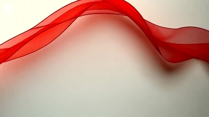 Wall Mural - elegant red sheer ribbon wavy design on a soft white background for celebrations