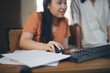 © prachid - Asian children using digital tablet with stylus pen write and do homework at home. Stress Thai Student working online to study for the exam. Education and E-learning concept.