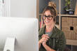 © simona - Professional young woman working in modern office with laptop and desktop computer – focused business environment, digital work, smart working and technology concept