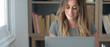 © simona - Professional young woman working in modern office with laptop and desktop computer – focused business environment, digital work, smart working and technology concept