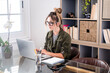 © simona - Young woman working remotely from home office with laptop – freelance job, smart working and digital lifestyle for modern business, remote work and independent career concept