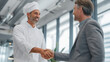© Pro Hi-Res - Chef and client shake hands in a modern restaurant during a business meeting in the afternoon.