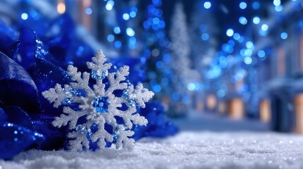 Wall Mural - Glittering snowflake ornament on snowy surface with blue holiday lights in the background, creating a festive winter atmosphere.