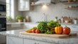 © Sam-th - Fresh Organic Vegetables Arranged on a Chopping Board in a Modern Kitchen Decorated with Greenery