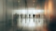 © Andi - Blurred figures walk a modern hallway